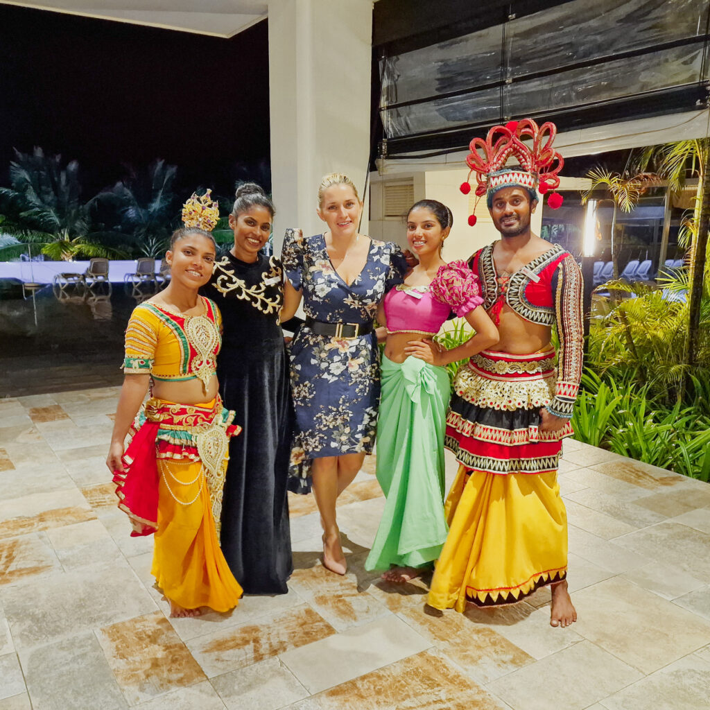 riu Sri Lanka staff dressed in Sri Lankan outfits standing with Kay