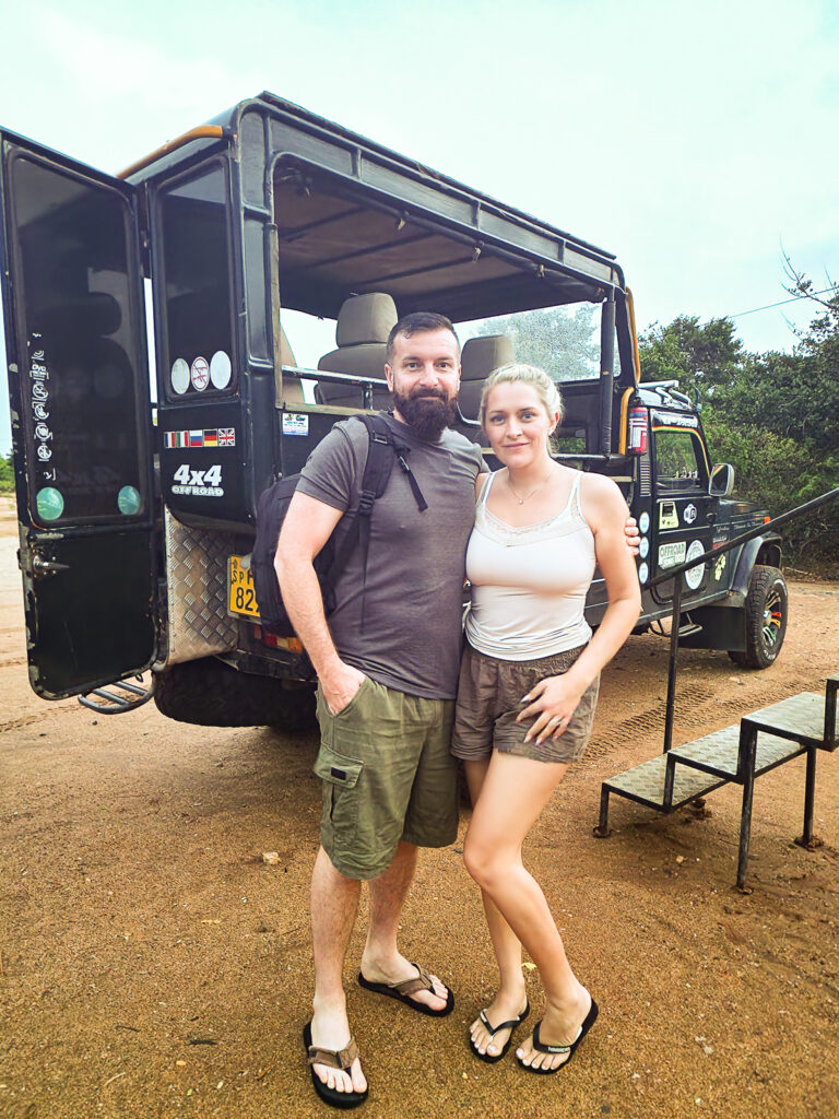 Luke and Kay standing in front of a safari jeep waiting to go on a Yala safari