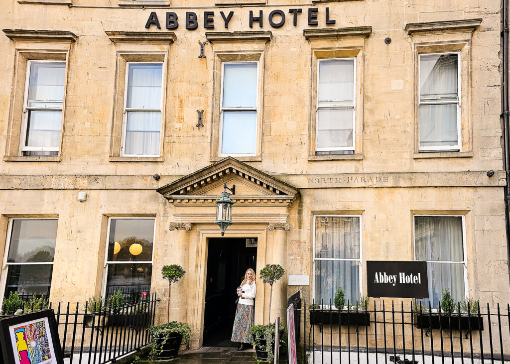 Kay standing outside the Abbey Hotel in Bath