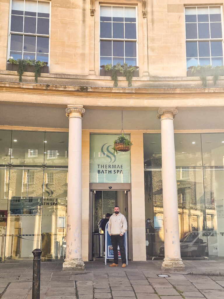 Luke standing outside the front entrance to the Thermae Bath Spa