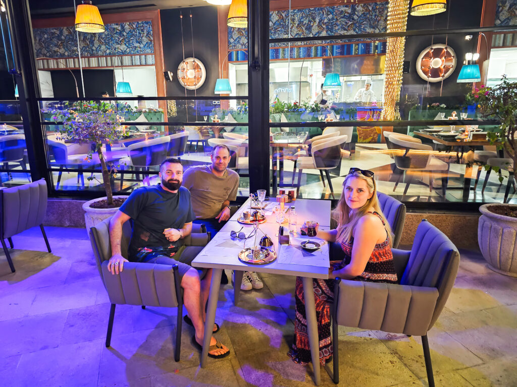 Luke, Kay and there friend Brian sitting in the outside seating area at Kasibeyaz in the Pearl Qatar