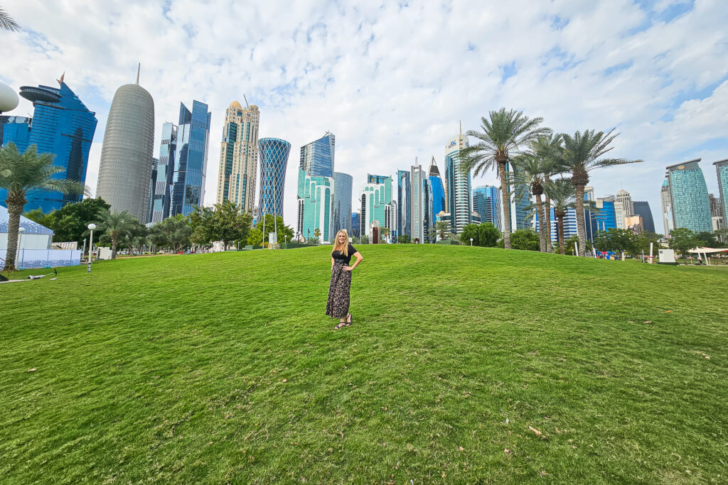 Kay standing in front of West Bay Qatar